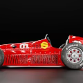 Red Vintage Racing Car With Streamlined Body Large Wheels And Green Roof