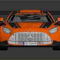 Orange Mercedes AMG Racing Car With Black Stripes And Large Rear Spoiler
