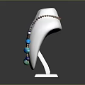 Elegant Fashion Necklace With Blue Green Beads On White Mannequin Against Dark Background