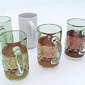 Assorted Colored Glass Mugs With Embossed Decorative Patterns And Transparent Design