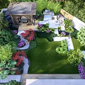 Rockery Stones Featured In Lush Garden Design With Green Lawn And Colorful Plants