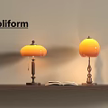 Poliform Table Lamps With Orange Shade Brass Base On Wooden Shelf Open Book Warm Light