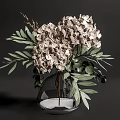 Transparent Glass Vase With Beige Hydrangea Flowers And Green Leaves Arrangement
