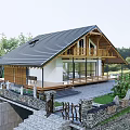 Wooden House with Black Roof Wooden Deck and Outdoor Seating Area Surrounded by Trees