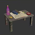 Wooden Table Setup With Bottle Binoculars Old Map Red Plate And Yellow Coins