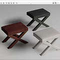 Three Colored Upholstered Stools In Red Black White With Cross Legged Design And Rivet Details