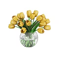 Yellow Tulips In Transparent Glass Vase With Green Stems And Water