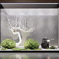 Serene Indoor Landscape Interior With White Decorative Tree Green Plants And Black Stone
