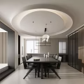 Modern Restaurant Interior With Circular Ceiling Pendant Light Wooden Dining Table And Black Chairs