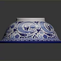 Blue and White Ceramic Sculpture Carving With Intricate Floral Patterns And Bowl Shape