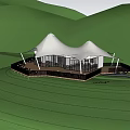White tent like building on hilltop in misty green meadow with distant mountains