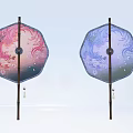 Two Pink And Blue Octagonal Hanging Decorations With Floral Patterns And Tassels