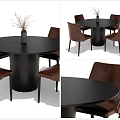 Round Black Dining Table Set With Brown Leather Chairs And Vase With Dried Flowers