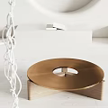 Minimalist Golden Round Coffee Table With Circular Cutout And Wooden Base In Modern Space
