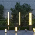 Various Styles of Illuminated Outdoor Lights in Garden with Grass Trees and Stone Wall