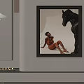 Black Framed Wall Art With Person In Orange Black Horse Sculpture And Pendant Light Candles