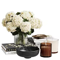 Decorative Ornament Set with White Hydrangea Glass Vase Books Black Bowl Gold Plate and Candles