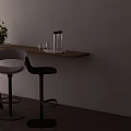 Modern Bar Stools By Wooden Counter With Plant And Glassware On Light Wall Background