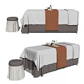 Spa Massage Bed With White Sheet Brown Towel Stool And Essential Oil Bottles