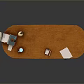 Wooden Oval Coffee Table with Scroll Teapot Blue Cup Books White Paper and Drawer