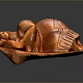 Wooden Sculpture Carving Of Curled Brown Figure With Detailed Texture Displayed On Dark Surface