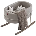 Gray Rocking Baby Crib With Metal Frame Wooden Rockers Star Patterned Pillows And Striped Blanket