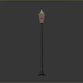 Classic Street Lamp With Ornate Metal Pole Yellow Light Shade And Decorative Top