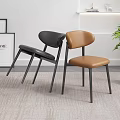 Modern Dining Chairs With Black And Brown Leather Seats Curved Backrests And Metal Legs