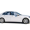 White Mercedes Benz Sedan With Modern Exterior Design And Front Grille Headlights