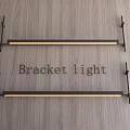 Modern Long Strip Bracket Light Mounted on Wooden Wall with Black and Gold Design