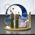 XO Brand Display Platform With Gold Columns Blue Arched Design And Geometric Spheres