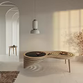 Modern Curved Wooden Coffee Table In Warm Sunlight With Decorative Plant And Side Table