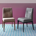 Brown And Gray Leather Dining Chairs Against Purple Wall With Blue White Checkered Carpet