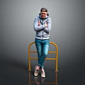 A Man In Gray Hoodie And Blue Jeans Leaning On Yellow Railing With Gray Background