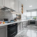 Modern Kitchen Interior With Gray Cabinets Marble Countertop And Natural Lighting