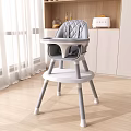 Gray Quilted Diamond Pattern High Chair With Tray In Modern Kitchen White Curtains Wooden Floor