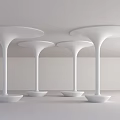 Four White Bell Shaped Columns With Circular Base And Wide Top In Sleek Modern Design