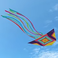 Vibrant Colorful Origami Kite With Geometric Pattern And Long Colorful Tails