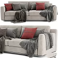 Light Gray Sofa With Red Gray Striped Pillows And Textured Blankets 3d model
