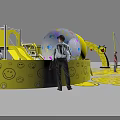 Smiley Face Themed Playground With Interactive Elements People Playing And Yellow Decorations