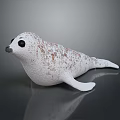 White Seal Figure With Brown Spots And Black Eyes On Smooth Surface