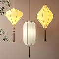 Hanging Chinese Lanterns in Yellow and White with Tassels and Bamboo Decor