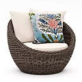 Round Wicker Leisure Chair With Beige Cushion And Colorful Floral Pattern Pillow