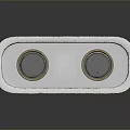 Metallic Rectangular Device With Dual Circular Components And Reflective Silver Surface