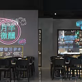 Modern Bar Interior With Bar Counter Bottle Shelves Circular Moon Lamp And Neon Lights