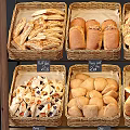 Wooden Bakery Display Shelves With Fresh Bread Pastries And Labeled Trays