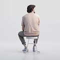 Two Men Sitting on White Stools Wearing Beige T-Shirts and Khaki Pants