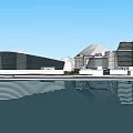 Modern Hotel Building With Waterfront Reflection And Mountain View Under Blue Sky