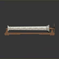 Industrial Mechanical Device Featuring White Textured Roller on Orange Metal Support Structure