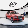 Red Rolls-Royce SUV on Display Stand With Person in Suit Beside